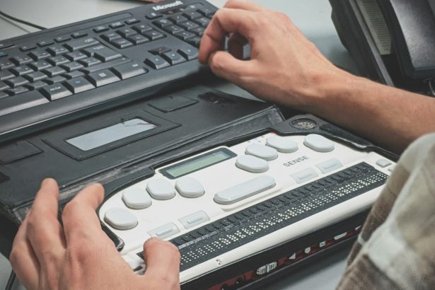 person using braille writer