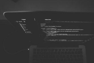 black and gray laptop displaying codes